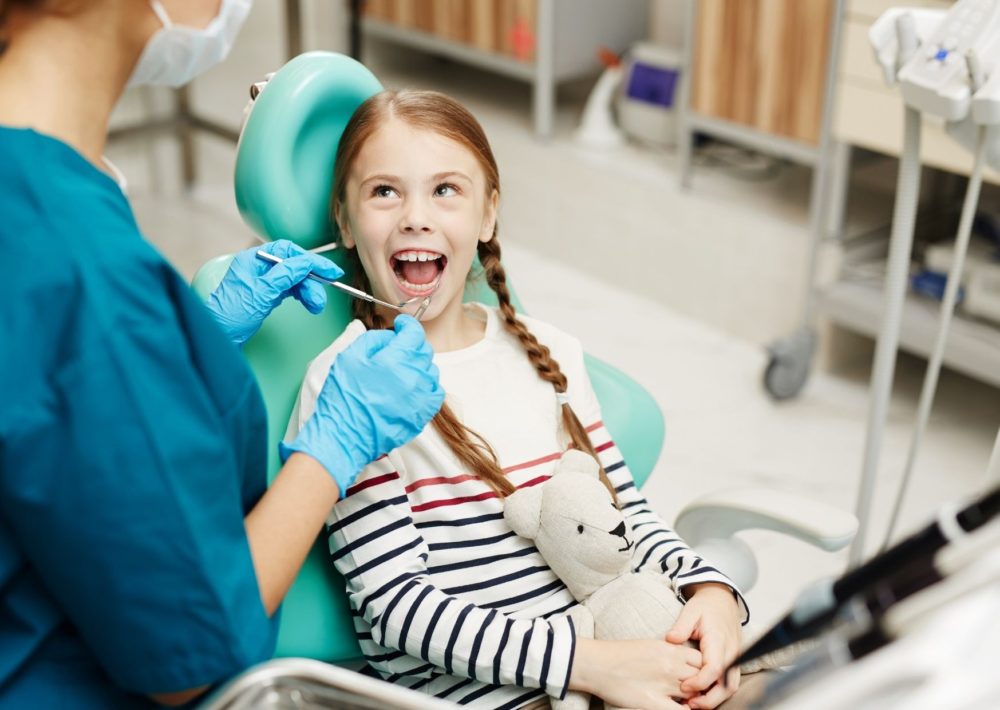 Children Dental Care - Kid at the dentists for a check-up